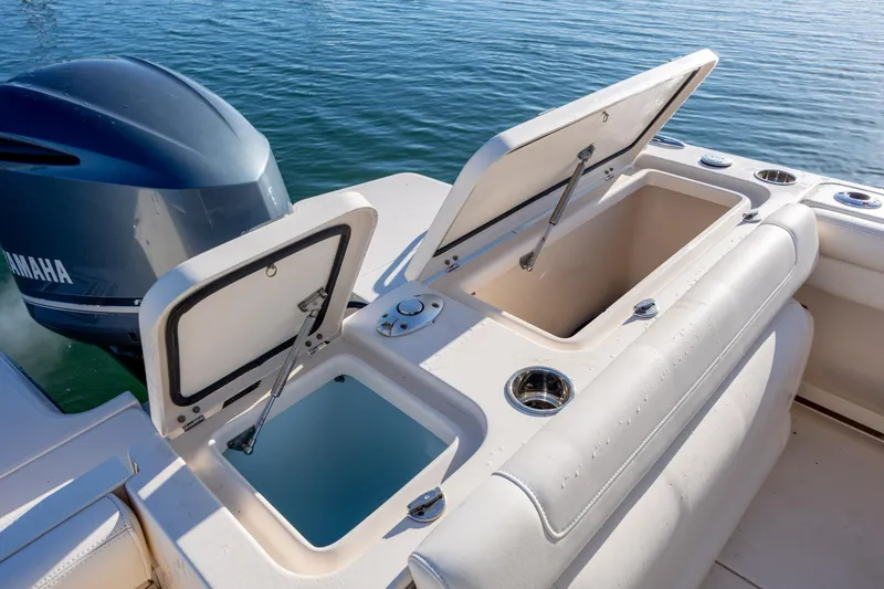 Slide: The Image of 2018 Grady-White Fisherman 236 boat with open storage compartments and Yamaha engine. - 15