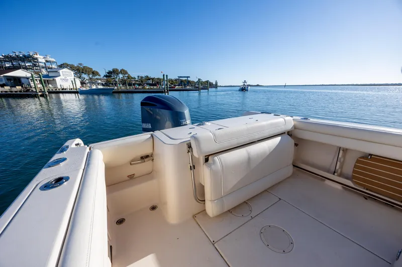 Slide: The Image of 2018 Grady-White Fisherman 236 boat with Yamaha engine on calm water. - 16