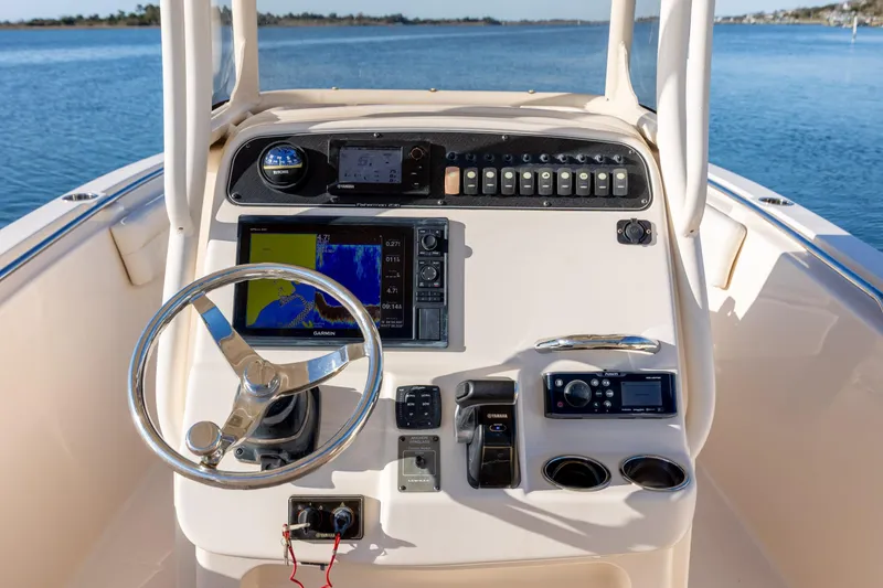 Slide: The Image of Grady-White Fisherman 236 boat dashboard with steering wheel and navigation equipment, 2018 model. - 20