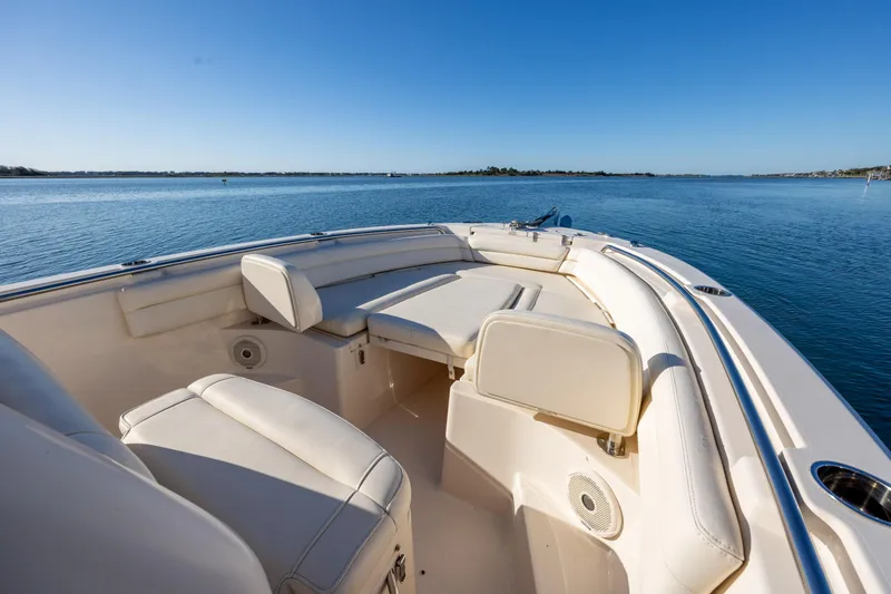 Slide: The Image of 2018 Grady-White Fisherman 236 boat interior with seating, on calm water. - 24
