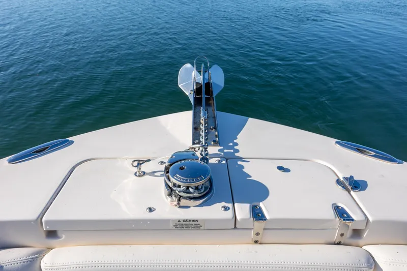 Slide: The Image of Bow of 2018 Grady-White Fisherman 236 boat with anchor and calm water. - 26