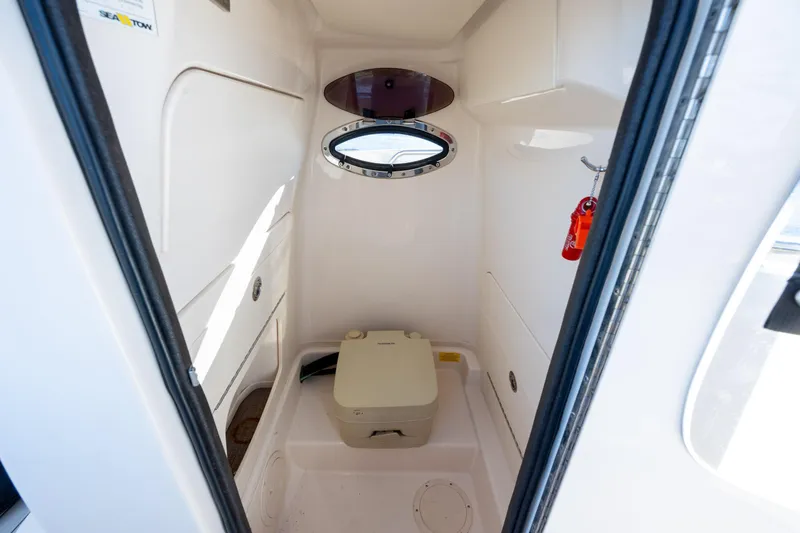Slide: The Image of Interior of 2018 Grady-White Fisherman 236 boat with compact marine toilet. - 28