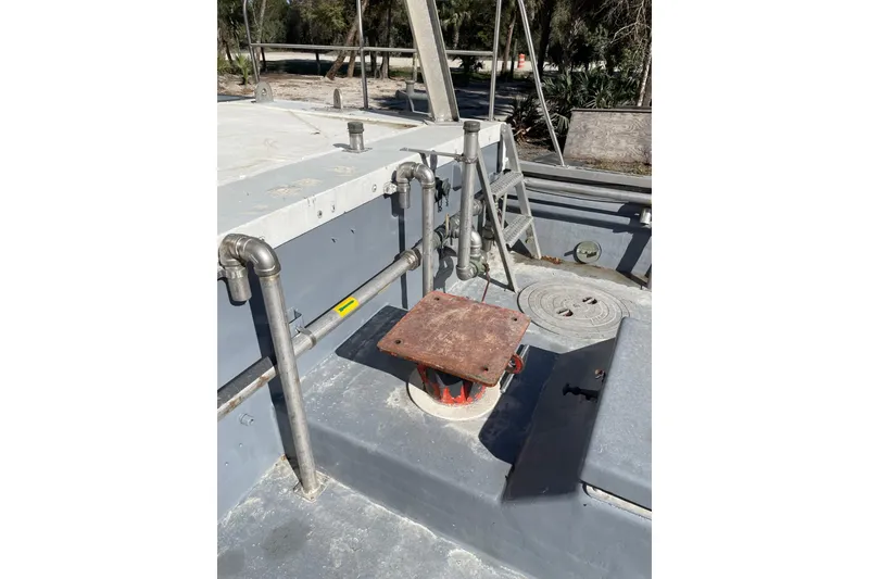 Slide: The Image of 1987 Commercial Buoy Tender deck with pipes and metal fittings. - 10