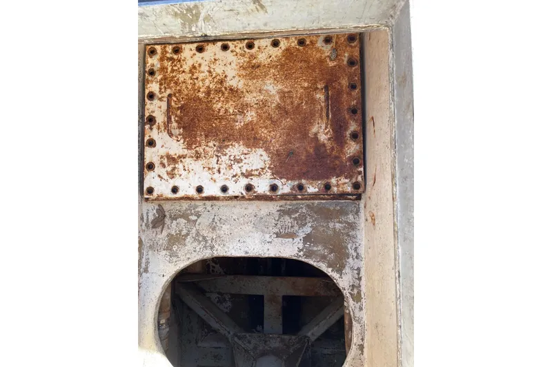 Slide: The Image of Rusty metal surface on 1987 commercial buoy tender, showing wear and weathering. - 12