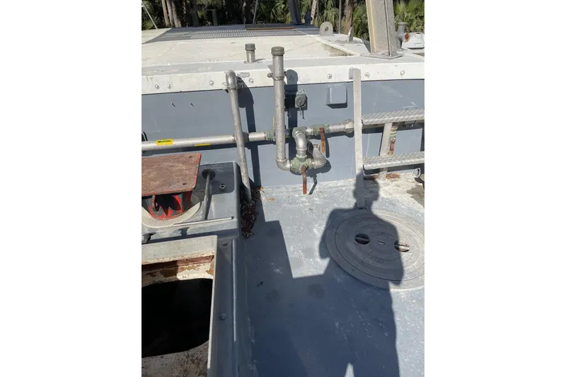 Slide: The Image of 1987 Commercial Buoy Tender deck with pipes and shadow in sunlight. - 14