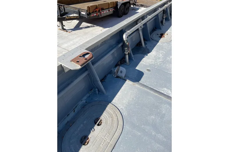 Slide: The Image of 1987 Commercial Buoy Tender deck with metal fittings and pipes. - 19