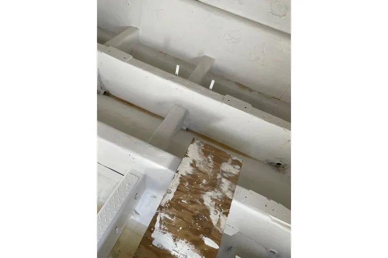 Slide: The Image of Interior view of a 1987 Commercial Buoy Tender, showing white painted surfaces and wooden elements. - 28