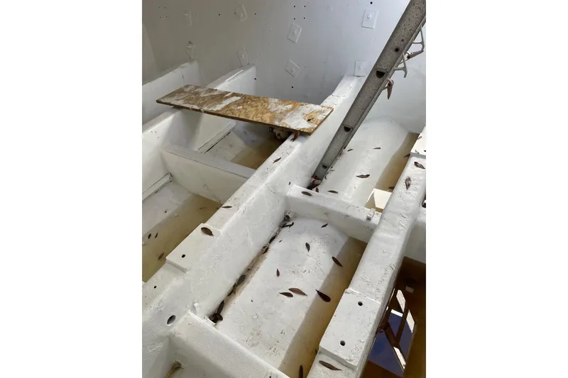 Slide: The Image of Interior view of a 1987 commercial buoy tender, showing structural framework and scattered debris. - 30