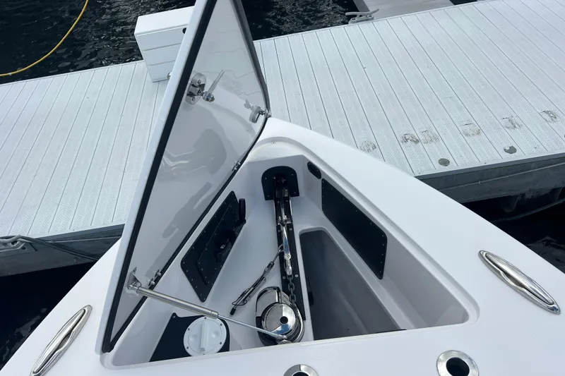 Slide: The Image of Open storage compartment on 2024 Nor-Tech 392 Super Fish boat at dock. - 5