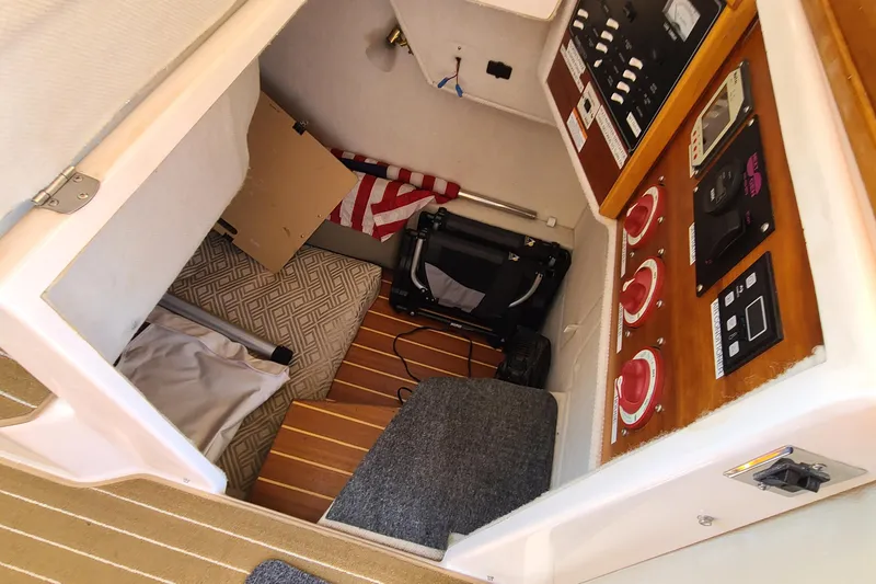 Slide: The Image of 2019 Cutwater C-28 LE interior with control panels and storage area. - 10