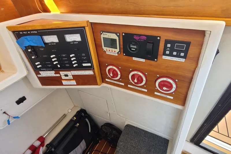 Slide: The Image of Control panel of a 2019 Cutwater C-28 LE boat with various switches and gauges. - 11