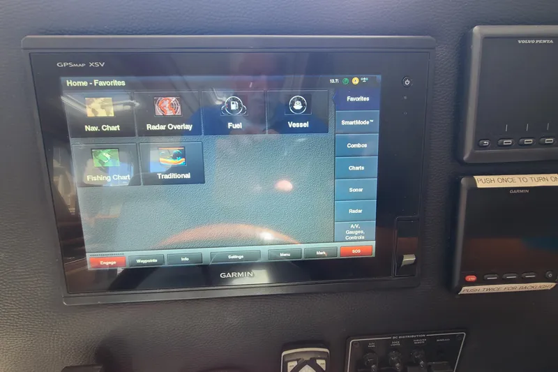 Slide: The Image of Garmin GPS display on 2019 Cutwater C-28 LE boat dashboard, showing navigation options. - 18