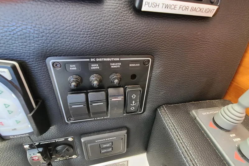 Slide: The Image of 2019 Cutwater C-28 LE control panel with DC distribution switches and windlass controls. - 20