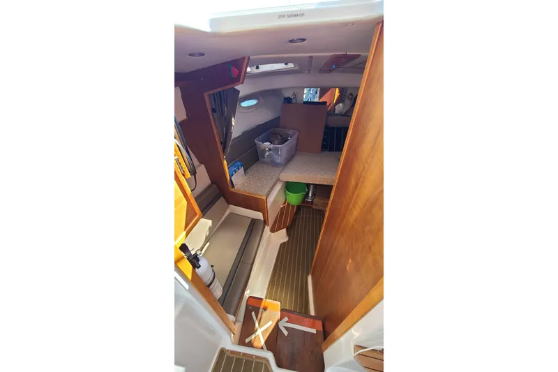 Slide: The Image of 2019 Cutwater C-28 LE boat interior with wood finish and seating area. - 34