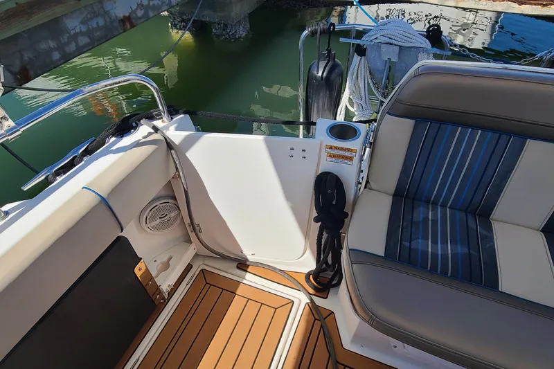 Slide: The Image of 2019 Cutwater C-28 LE boat interior with striped seating and teak flooring. - 5
