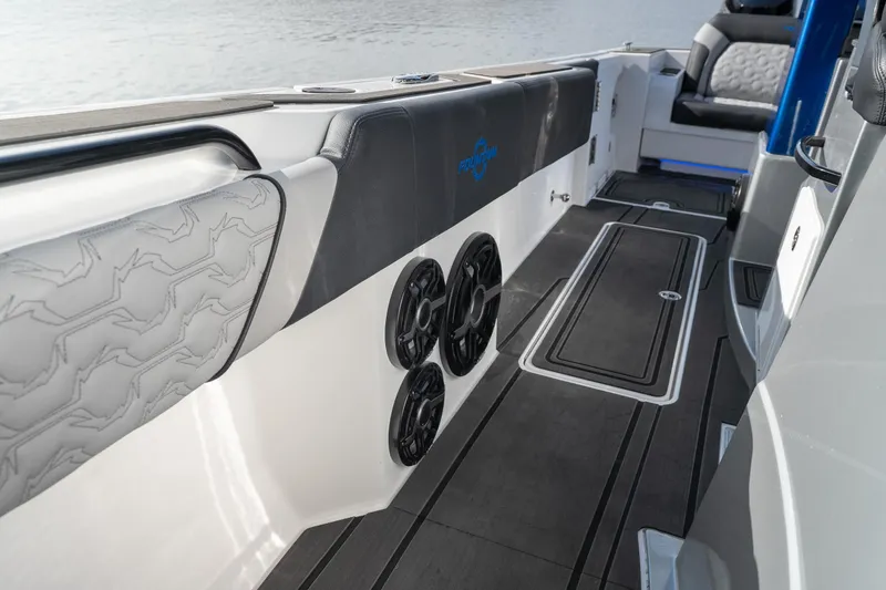 Slide: The Image of 2025 Fountain 43 SCX boat interior with sleek seating and modern audio system. - 12