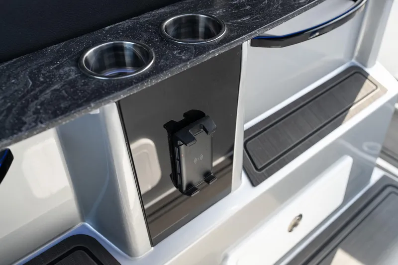 Slide: The Image of 2025 Fountain 43 SCX boat interior with cup holders and phone mount. - 17