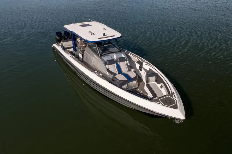 Slide: The Image of 2025 Fountain 43 SCX boat on calm water, showcasing sleek design and modern features. - 18