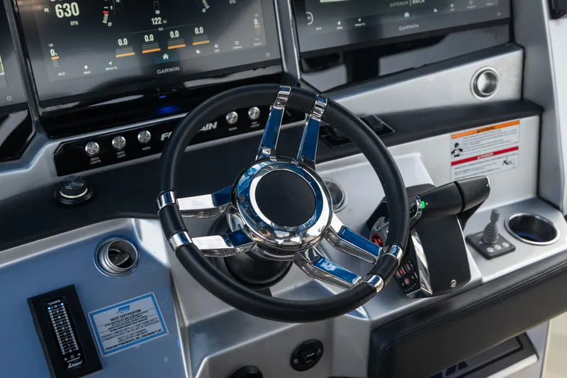 Slide: The Image of Steering wheel and dashboard of 2025 Fountain 43 SCX boat with modern controls. - 24