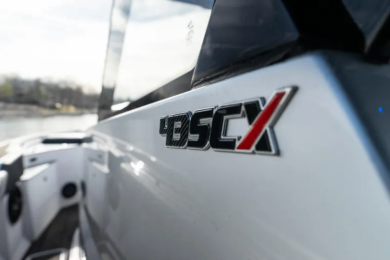 Slide: The Image of Close-up of 2025 Fountain 43 SCX boat logo on sleek exterior. - 25
