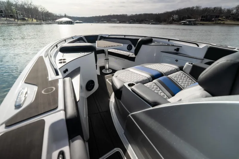 Slide: The Image of 2025 Fountain 43 SCX boat interior with luxurious seating and scenic lake view. - 26
