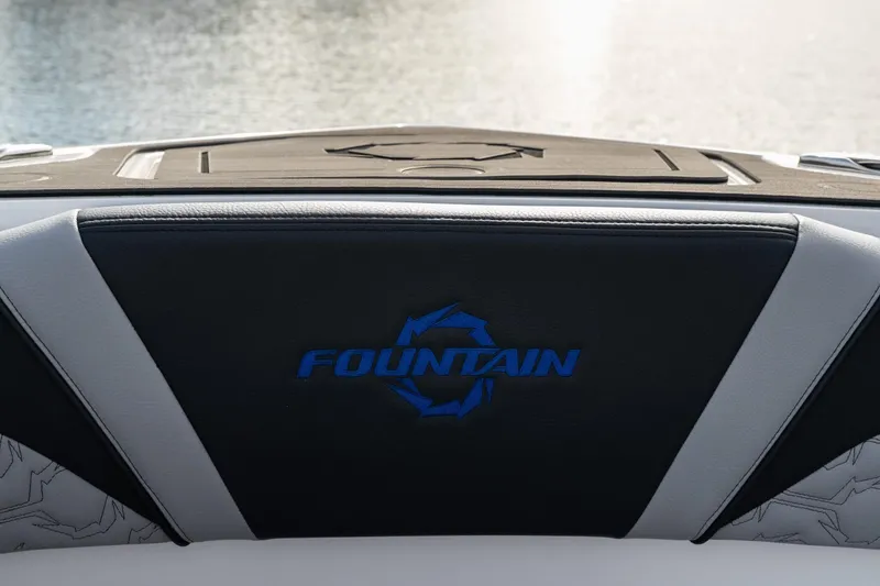 Slide: The Image of 2025 Fountain 43 SCX boat interior with logo, featuring sleek black and gray design. - 29