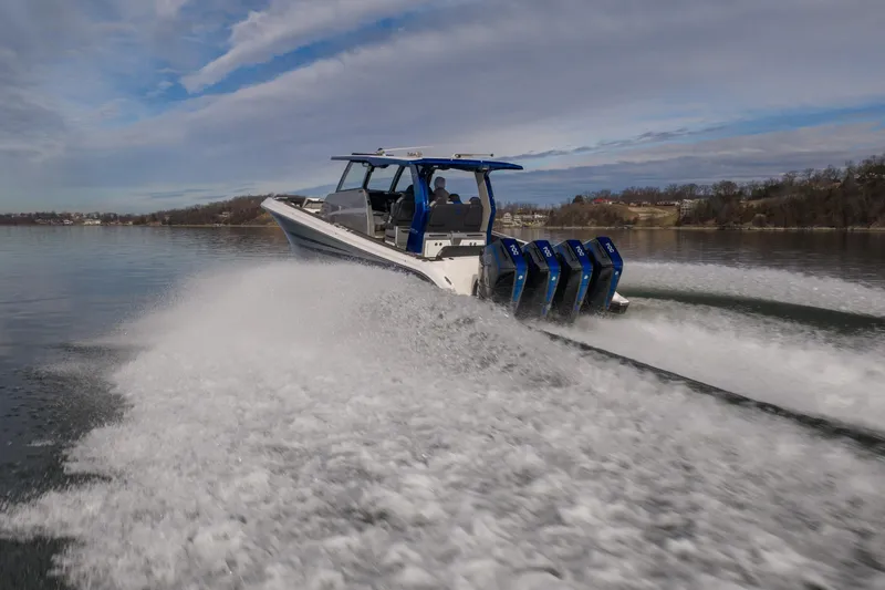 Slide: The Image of 2025 Fountain 43 SCX speedboat cruising on a lake with powerful engines. - 4