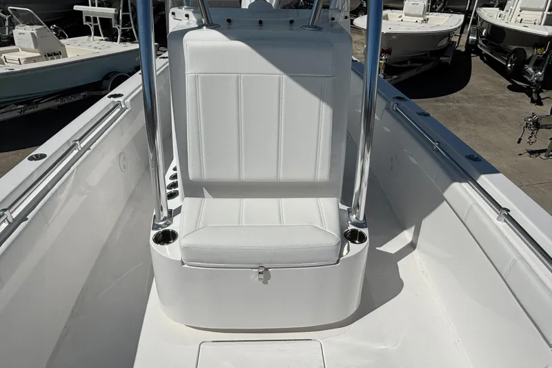 Slide: The Image of 2026 Contender 24 Sport boat interior with white seating and stainless steel accents. - 5