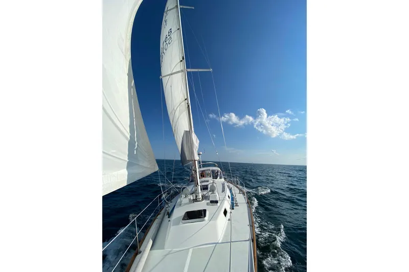 Slide: The Image of 1997 J Boats J/42 sailboat navigating open sea. - 11