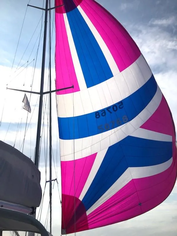 Slide: The Image of 1997 J Boats J/42 sailboat with vibrant spinnaker. - 14