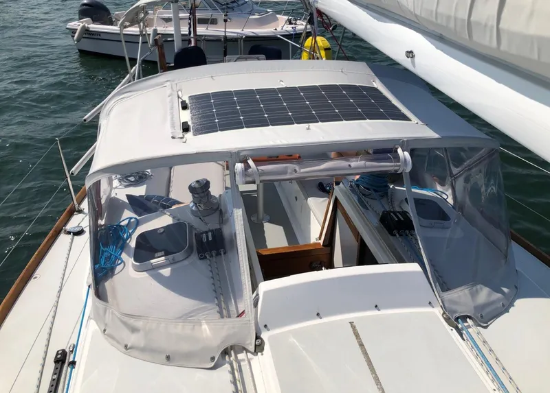 Slide: The Image of 1997 J Boats J/42 sailboat with solar panel on deck. - 23