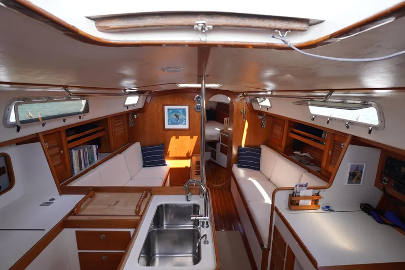 Slide: The Image of Interior of a 1997 J Boats J/42 yacht, featuring elegant wood finishes. - 33