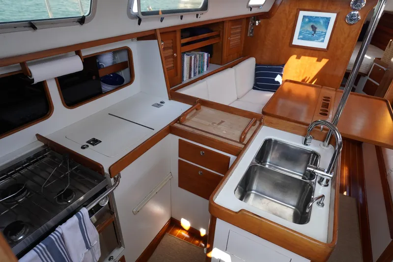 Slide: The Image of Interior of 1997 J Boats J/42 yacht with kitchen and seating area. - 38
