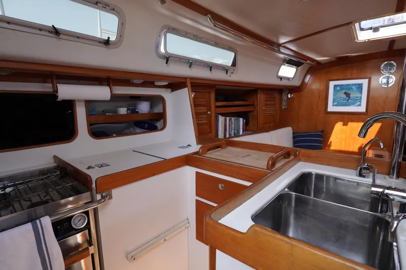 Slide: The Image of Interior of 1997 J Boats J/42 yacht with kitchen and wood paneling. - 39