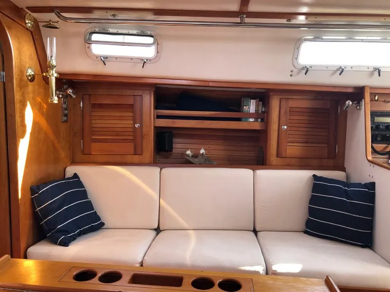 Slide: The Image of Interior of a 1997 J/42 yacht with cozy sofa. - 42
