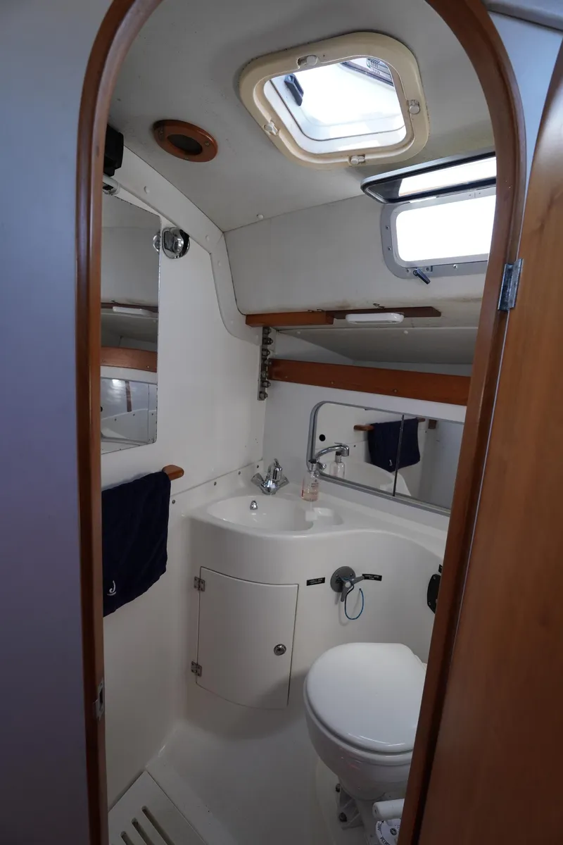 Slide: The Image of Interior of a 1997 J Boats J/42 yacht with wooden doors and basket. - 48