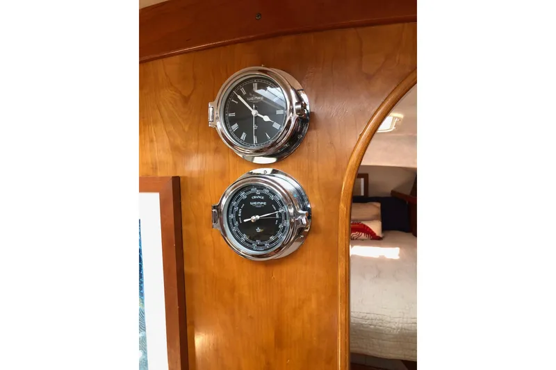 Slide: The Image of Chrome nautical instruments on wooden panel inside 1997 J Boats J/42 yacht cabin. - 60