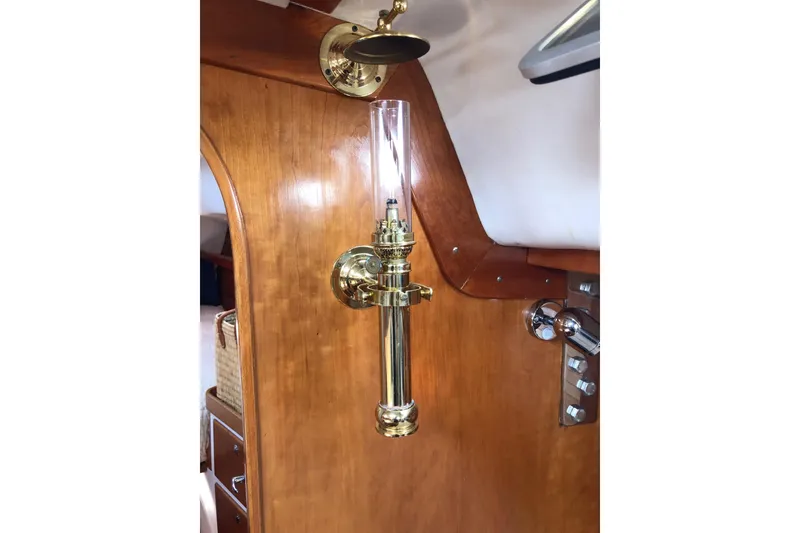 Slide: The Image of Brass oil lamp on 1997 J Boats J/42 wooden interior wall. - 61
