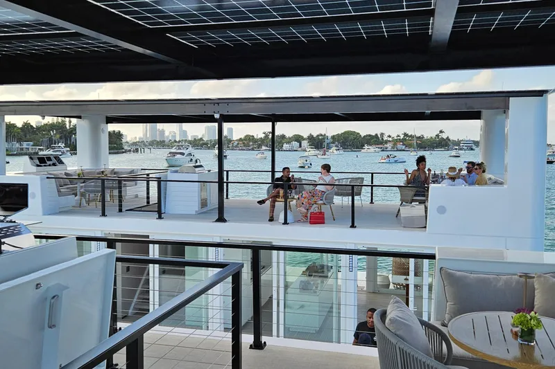 Slide: The Image of Modern ARKHAUS Villa 50 (2025) with rooftop seating, overlooking scenic waterfront and boats. - 10