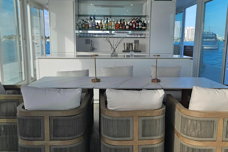 Slide: The Image of Luxurious ARKHAUS Villa 50 interior with elegant bar and waterfront view, 2025 model. - 7