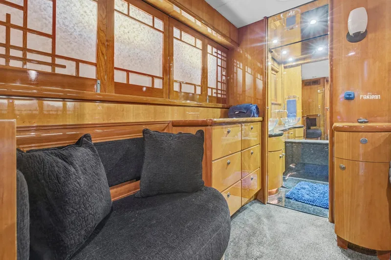 Slide: The Image of Luxurious interior of 2004 Queenship 76 Baretta yacht with elegant wood finishes and plush seating. - 18