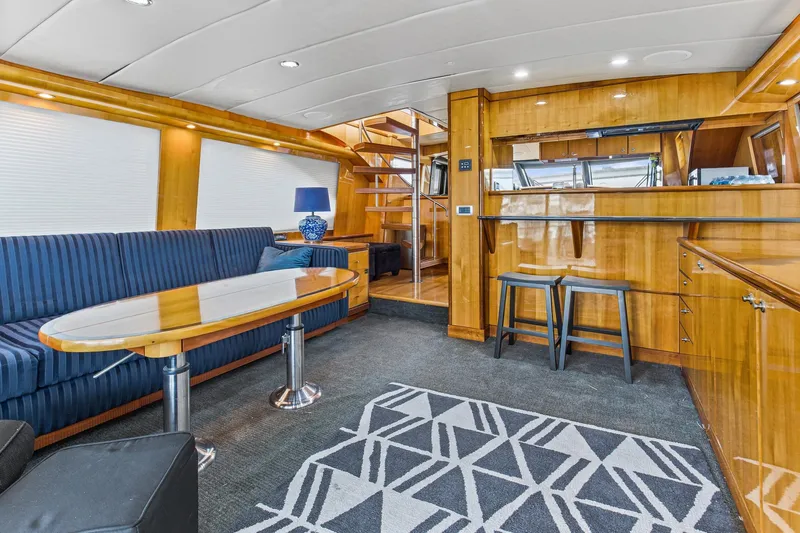 Slide: The Image of Luxurious interior of 2004 Queenship 76 Baretta yacht with elegant wood finishes and modern furnishings. - 27
