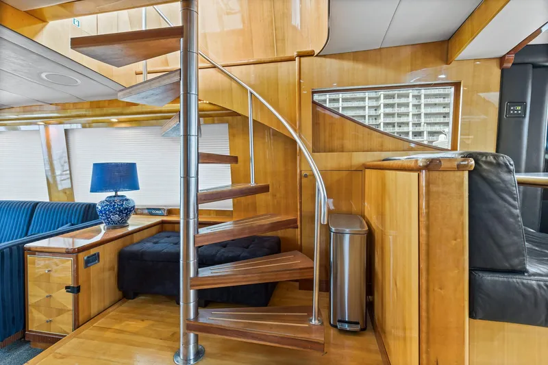 Slide: The Image of Luxurious interior of 2004 Queenship 76 Baretta yacht with spiral staircase and elegant decor. - 30