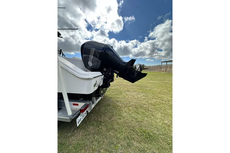 Slide: The Image of 2021 Sportsman Open 282 Center Console with Yamaha outboard motor on trailer. - 14