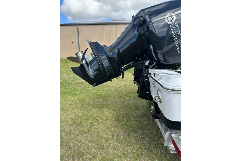 Slide: The Image of 2021 Sportsman Open 282 Center Console with Yamaha outboard motor on grass. - 15