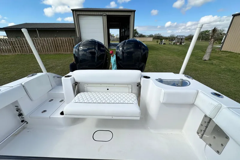 Slide: The Image of 2021 Sportsman Open 282 Center Console boat with dual engines and seating. - 18