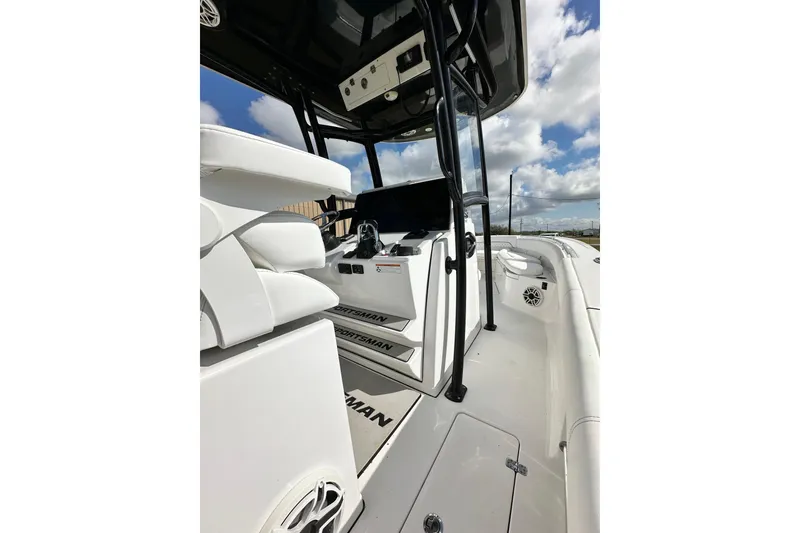Slide: The Image of 2021 Sportsman Open 282 Center Console boat interior with seating and console view. - 26