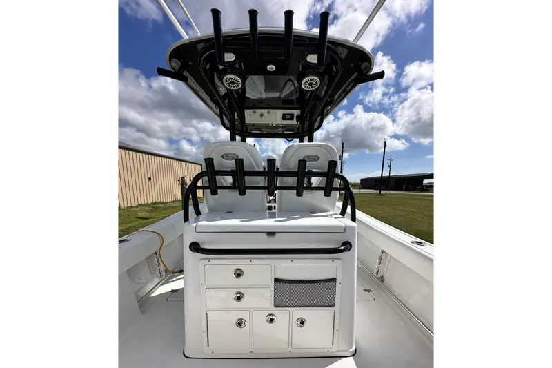 Slide: The Image of 2021 Sportsman Open 282 Center Console boat interior with seating and storage compartments. - 28
