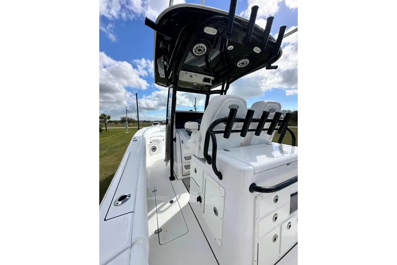 Slide: The Image of 2021 Sportsman Open 282 Center Console boat interior with seating and rod holders. - 30