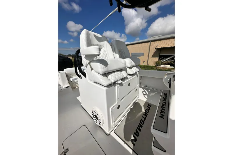 Slide: The Image of 2021 Sportsman Open 282 Center Console boat with white cushioned seating. - 33